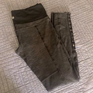 Lululemon leggings with side buttons, knee panels black and grey
